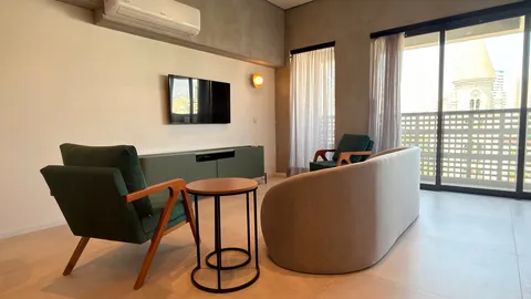 Two-bedroom Master Apartment at Heritage X, with a living area, kitchen and balcony