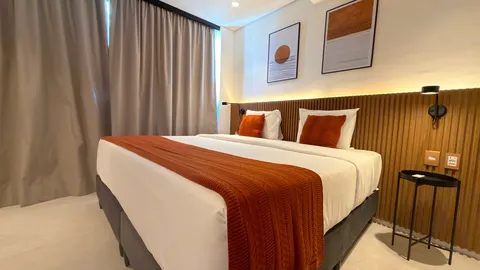 Two-bedroom Master Apartment at Heritage X, with a living area, kitchen and balcony