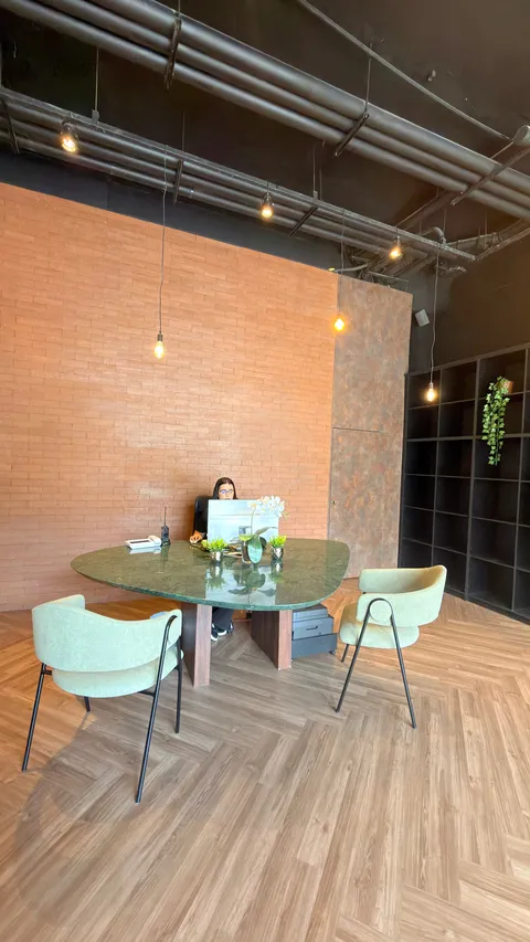 Reception and restaurant at Heritage X, with tables, plants and natural light