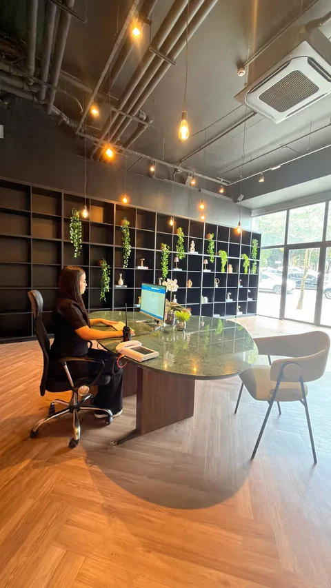 Reception and restaurant at Heritage X, with tables, plants and natural light