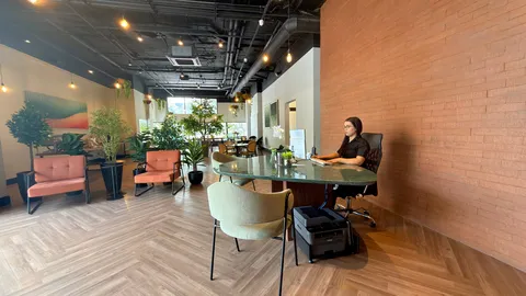 Reception and restaurant at Heritage X, with tables, plants and natural light