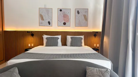 Studio at Heritage X, with a king bed, living area and equipped kitchen
