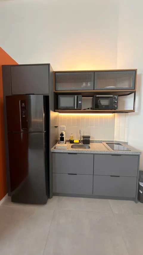 Studio at Heritage X, with a king bed, living area and equipped kitchen