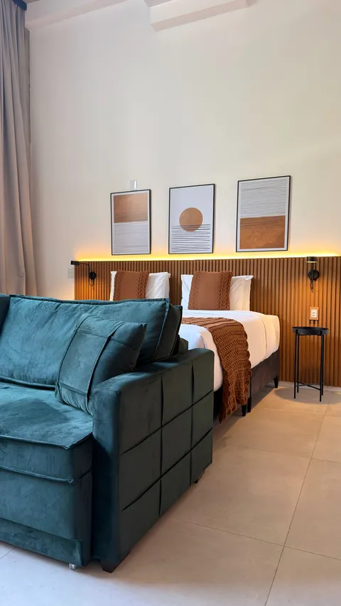 Studio at Heritage X, with a king bed, living area and equipped kitchen