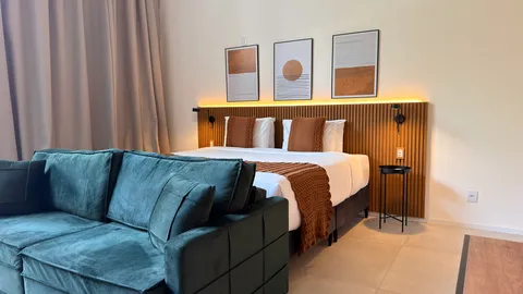 Studio at Heritage X, with a king bed, living area and equipped kitchen