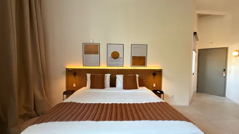 Studio at Heritage X, with a king bed, living area and equipped kitchen
