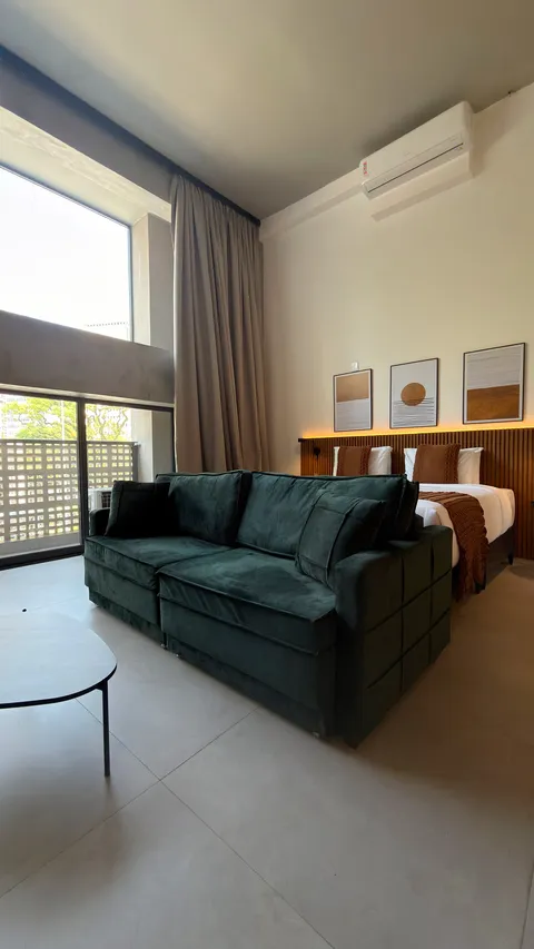 Studio at Heritage X, with a king bed, living area and equipped kitchen