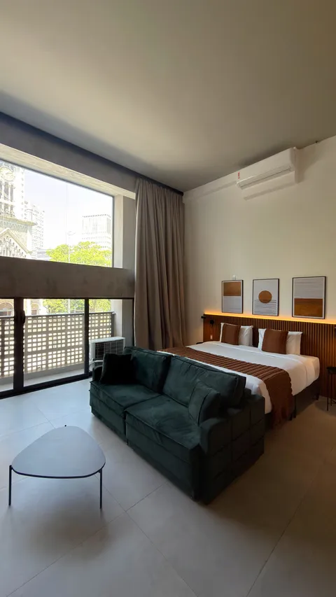 Studio at Heritage X, with a king bed, living area and equipped kitchen