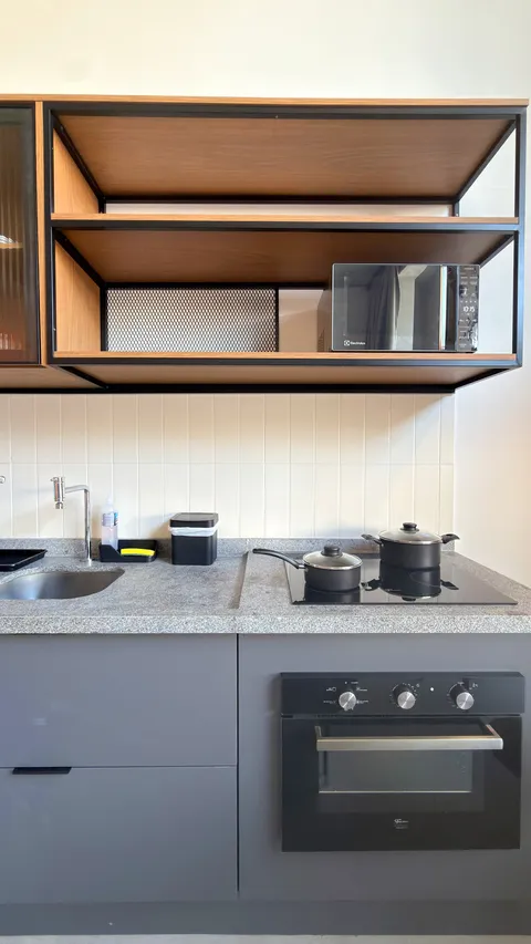 Studio at Heritage X, with a king bed, living area and equipped kitchen
