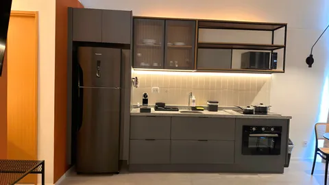 Studio at Heritage X, with a king bed, living area and equipped kitchen
