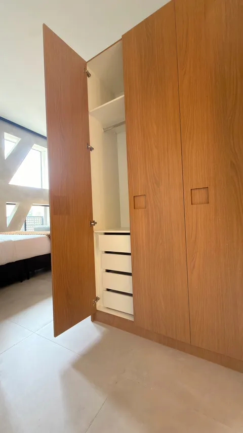Studio at Heritage X, with a king bed, living area and equipped kitchen