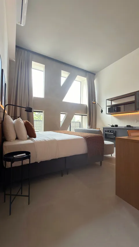 Studio at Heritage X, with a king bed, living area and equipped kitchen
