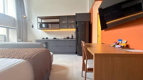 Studio at Heritage X, with a king bed, living area and equipped kitchen