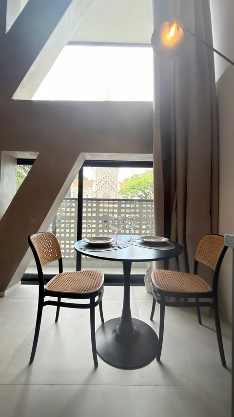 Studio at Heritage X, with a king bed, living area and equipped kitchen