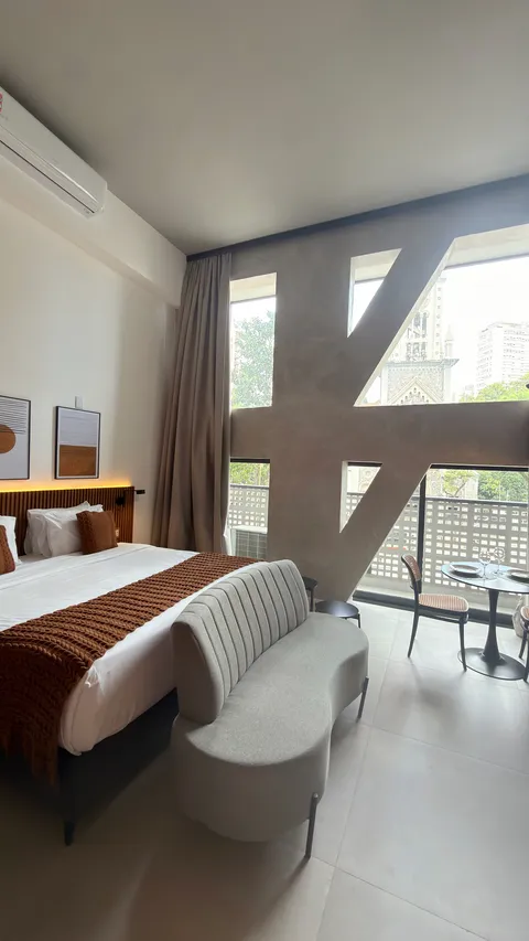 Studio at Heritage X, with a king bed, living area and equipped kitchen