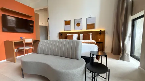 Studio at Heritage X, with a king bed, living area and equipped kitchen
