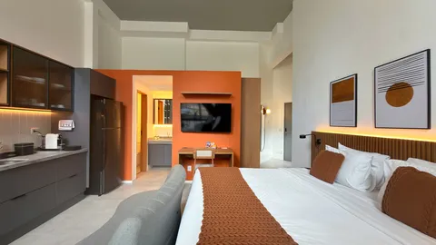 Studio at Heritage X, with a king bed, living area and equipped kitchen