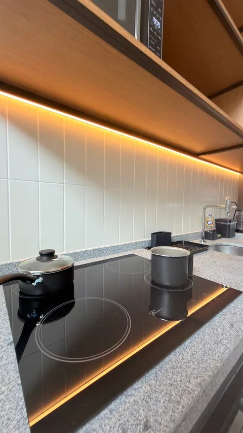 Studio at Heritage X, with a king bed, living area and equipped kitchen