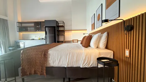 Studio at Heritage X, with a king bed, living area and equipped kitchen