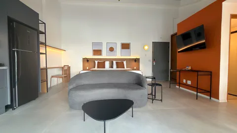 Studio at Heritage X, with a king bed, living area and equipped kitchen