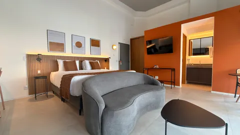 Studio at Heritage X, with a king bed, living area and equipped kitchen