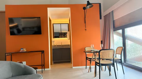Studio at Heritage X, with a king bed, living area and equipped kitchen